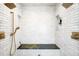 Large shower featuring dual shower heads, a handheld sprayer, and built-in niche at 3148 Keep Dr, Sedalia, CO 80135