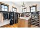 Spacious walk-in closet with ample storage, a wood island with marble countertop, and windows at 3148 Keep Dr, Sedalia, CO 80135