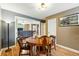 Cozy dining area with hardwood floors and wooden table with seating for four at 2461 Niagara St, Denver, CO 80207