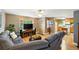 Bright living room with open access to the kitchen, featuring a comfortable sectional sofa at 2461 Niagara St, Denver, CO 80207