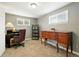 Functional office with neutral carpet, large desk, office chair and a wood sideboard at 2461 Niagara St, Denver, CO 80207