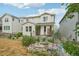 Well-manicured backyard showcasing manicured landscaping and water feature at 8926 Swan River St, Littleton, CO 80125