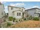 Exterior of home featuring well-maintained lawn, mature landscaping and privacy fence at 8926 Swan River St, Littleton, CO 80125