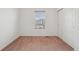 Neutral-toned bedroom with a window, offering simple elegance at 8926 Swan River St, Littleton, CO 80125