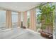 Charming covered porch with neutral drapes and view of beautifully landscaped garden at 8926 Swan River St, Littleton, CO 80125