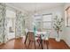 Bright dining area with wood floors and sliding doors leading to the patio at 8926 Swan River St, Littleton, CO 80125