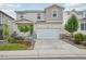 Attractive two-story home offering a two-car garage, a covered porch, and a landscaped garden at 8926 Swan River St, Littleton, CO 80125