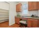 Cozy office space with built in desk, cabinets, drawers and shelving for pantry at 8926 Swan River St, Littleton, CO 80125