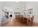 Dining room with hardwood floors, chandelier, and view of the staircase at 9878 Mulberry Way, Highlands Ranch, CO 80129