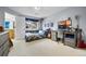 Bedroom with a large window, neutral colors, a workstation, and a bed at 2492 Baldy Ln, Evergreen, CO 80439