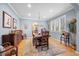 Elegant dining room with hardwood floors, chandelier and wainscoting at 2492 Baldy Ln, Evergreen, CO 80439