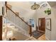 Inviting entryway with staircase and a decorative chandelier illuminating the space at 2492 Baldy Ln, Evergreen, CO 80439