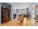 Cozy living room featuring a fireplace, built-in shelving, and abundant natural light at 2492 Baldy Ln, Evergreen, CO 80439