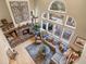 An aerial view of the comfy living room. Stone fireplace and natural light at 2492 Baldy Ln, Evergreen, CO 80439