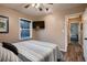 Bedroom with a large bed, ceiling fan, and a view of the pool outside the window at 4329 S Clarkson St, Englewood, CO 80113