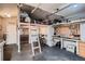 Spacious garage with a workbench, overhead storage, and room for bicycles and other equipment at 4329 S Clarkson St, Englewood, CO 80113