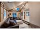 Living room featuring a sectional sofa, skylights, and an open layout at 4329 S Clarkson St, Englewood, CO 80113
