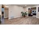 Hardwood floors provide character for this living room with access to other spaces at 4329 S Clarkson St, Englewood, CO 80113
