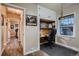 Home office area featuring built in cabinets and desk near a sunny window; great home work space at 4329 S Clarkson St, Englewood, CO 80113