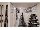 Workout room with various workout machines and equipment and a small wall-mounted shelf at 4329 S Clarkson St, Englewood, CO 80113