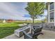 Outdoor living space featuring a fire pit and chairs with mountain views at 7401 Deerfield Rd, Longmont, CO 80503