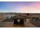 Relaxing patio with fire pit, chairs, and mountain views at 7401 Deerfield Rd, Longmont, CO 80503