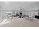 Spacious game room with ping pong table, seating area, and mountain views at 7401 Deerfield Rd, Longmont, CO 80503