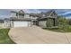 Attached two car garage and additional garage with grey horizontal siding at 7401 Deerfield Rd, Longmont, CO 80503