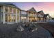 Luxury home exterior with fire pit and backyard at 7401 Deerfield Rd, Longmont, CO 80503