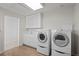 Functional laundry room with washer, dryer, and cabinets at 7401 Deerfield Rd, Longmont, CO 80503