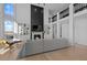 Open living space with a large fireplace, built-in shelving, and hardwood floors at 7401 Deerfield Rd, Longmont, CO 80503