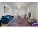 Bright playroom with ample space, plush sofa, and colorful rug at 7401 Deerfield Rd, Longmont, CO 80503