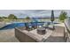 Outdoor living area with covered pool, wicker furniture, and mountain views at 7401 Deerfield Rd, Longmont, CO 80503