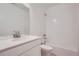 Clean bathroom with white vanity and bathtub at 6906 Kendrick Ln, Arvada, CO 80007