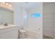 Clean bathroom with white vanity and bathtub at 6906 Kendrick Ln, Arvada, CO 80007