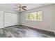 Bedroom with closets and a large window at 1202 S Troy St, Aurora, CO 80012