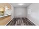 Bright dining area adjacent to the kitchen features hardwood floors and natural light at 1202 S Troy St, Aurora, CO 80012