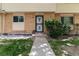 Charming exterior front entrance with brick accents and a security door at 1202 S Troy St, Aurora, CO 80012