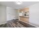 A modern kitchen and breakfast nook area offers an open floorplan at 1202 S Troy St, Aurora, CO 80012