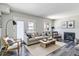 Bright living room with a fireplace, stylish furnishings, and a walk-out patio at 1202 S Troy St, Aurora, CO 80012