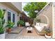 Cozy outdoor seating on a paved patio with modern furniture and string lights at 1202 S Troy St, Aurora, CO 80012