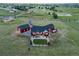 Picture of the home from above, showing the large backyard with a stone patio and green lawn at 3124 Antelope Ridge Trl, Parker, CO 80138