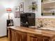 This basement bar offers a sink, a fridge, stone backsplash, and unique decor at 3124 Antelope Ridge Trl, Parker, CO 80138