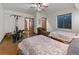Spacious bedroom featuring two beds, a ceiling fan, exercise equipment and neutral walls at 3124 Antelope Ridge Trl, Parker, CO 80138