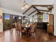 Spacious dining room with vaulted ceiling, wooden beams, and decorative chandeliers at 3124 Antelope Ridge Trl, Parker, CO 80138