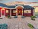 Beautiful front entrance with a stone pathway, covered porch, and stone columns, perfect for welcoming guests at 3124 Antelope Ridge Trl, Parker, CO 80138