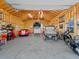 Large garage featuring multiple cars, storage shelves and a lift at 3124 Antelope Ridge Trl, Parker, CO 80138