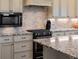 Close up of gourmet kitchen with stainless appliances and granite countertops at 3124 Antelope Ridge Trl, Parker, CO 80138
