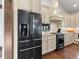 Modern kitchen featuring stainless appliances and stone countertops at 3124 Antelope Ridge Trl, Parker, CO 80138