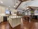Open-concept kitchen and dining area with high ceilings and plenty of light at 3124 Antelope Ridge Trl, Parker, CO 80138